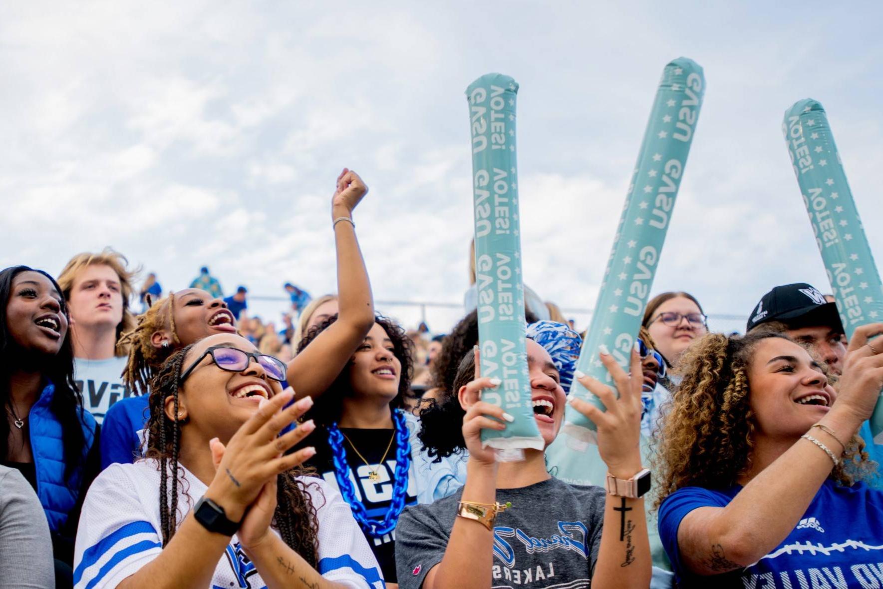 Fans cheer on the Lakers and anchor up during a football game